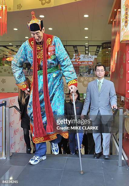 Bao Xishun of China, the worlds tallest living man, appears at a shopping mall during a promotion in Hong Kong on January 10, 2009. Bao who was born...