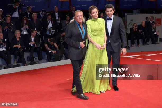 Armand Assante, Lola Karimova-Tillyaeva and and Timur Tillyaev walk the red carpet ahead of the 'Victoria & Abdul' screening during the 74th Venice...