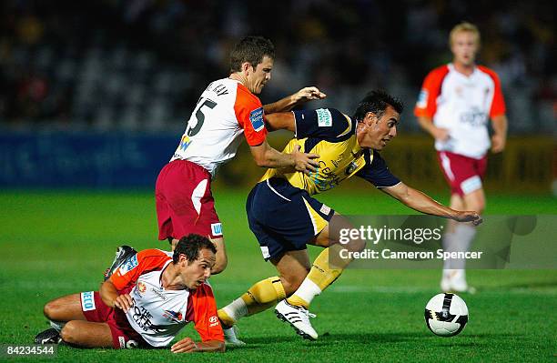 Adrian Caceres of the Mariners breaks through the Roar defence during the round 19 A-League match between the Central Coast Mariners and the...