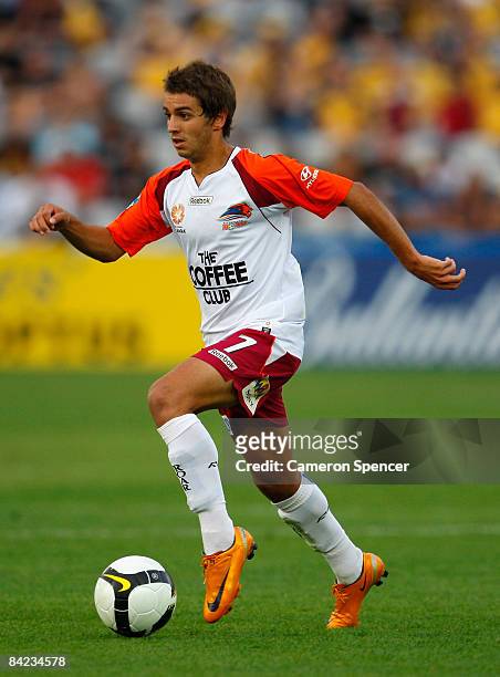 Michael Zullo of the Roar dribbles the ball during the round 19 A-League match between the Central Coast Mariners and the Queensland Roar at...