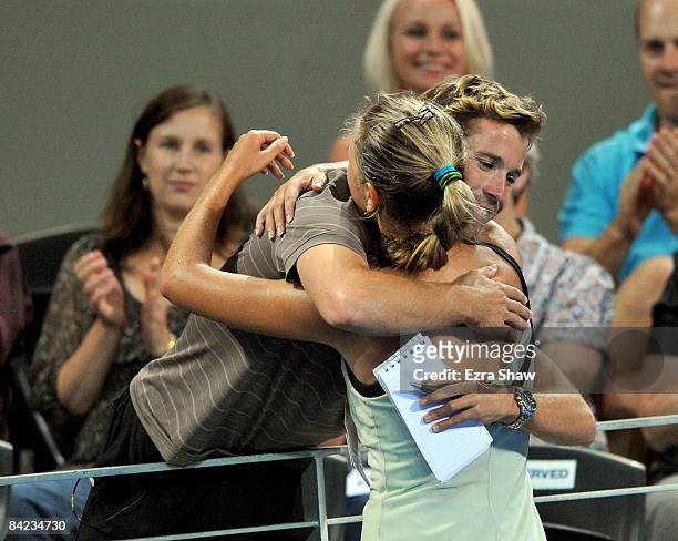 Victoria Azarenka of Belarus hugs her coach Antonio Van Grichen after beating Marion Bartoli of France in the women's finals match on day seven of...
