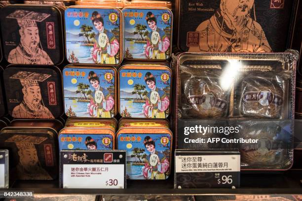 In this picture taken on September 3 mooncakes are displayed for sale at a bakery inside a train station in Hong Kong. It is one of Hong Kong's most...