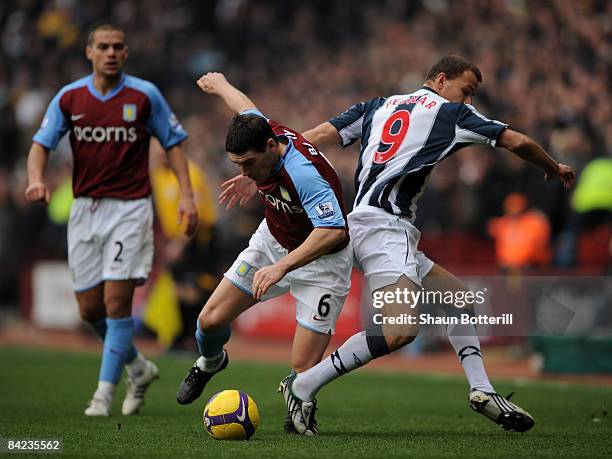 Gareth Barry of Aston Villa is challenged by Roman Bednar of West Bromwich Albion during the Barclays Premier League match between Aston Villa and...