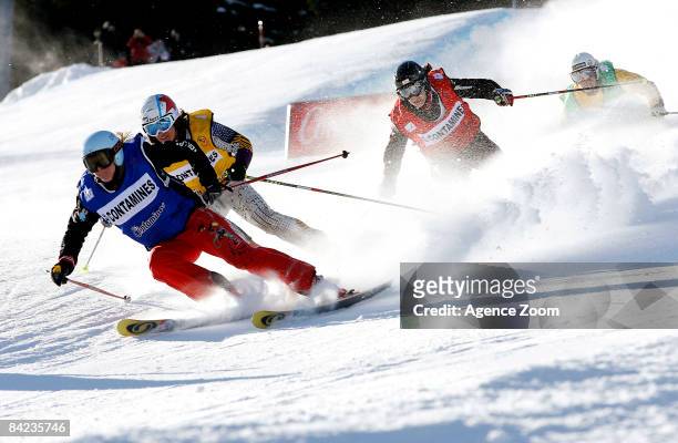 Ophelie David of France skis as she takes 2nd place Hedda Berntsen of Norway skis as she takes 1st place and Katrin Orner of Austria skis as she...