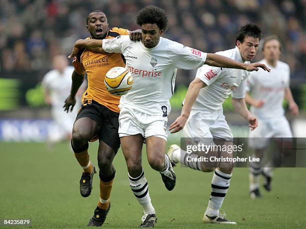 Sylvan Ebanks-Blake of Wolves battles with Youl Mawene of Preston during the Coca-Cola Championship match between Wolverhampton Wanderers and Preston...