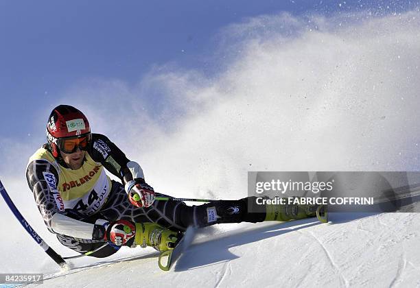 Jake Zamansky of the US clears a gate on his way to place 27th in the Men's giant slalom at the FIS Alpine Skiing World Cup on January 10, 2009 in...