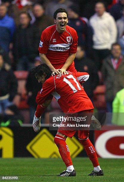 Stewart Downing of Middlesbrough celebrates with Tuncay Sanli after providing the cross for Afonso Alves to score the opening goal during the...