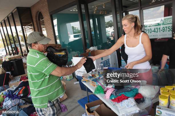 Tiffany Quillen helps to distribute relief supplies that she and a group of friends brought from North Carolina to flood victims after torrential...