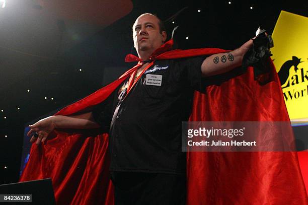 Ted Hankey of England arrives on stage before he plays Martin Adams of England during The Lakeside World Darts Championships Semi Final match at...
