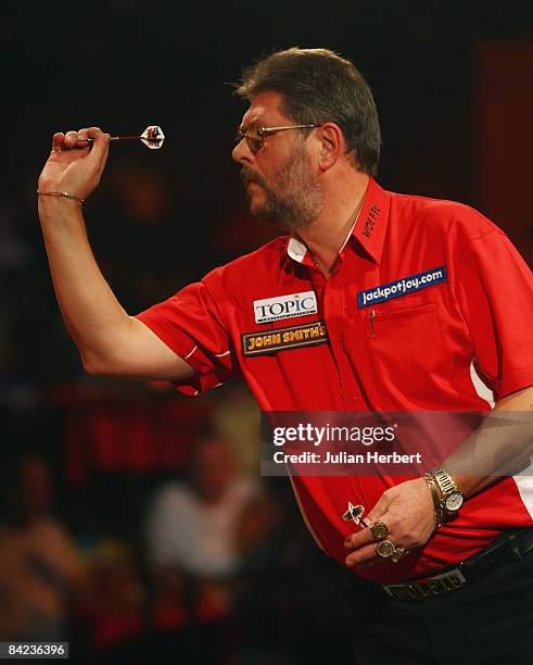 Martin Adams of England in action against Ted Hankey of England during The Lakeside World Darts Championships Semi Final match at Lakeside on January...