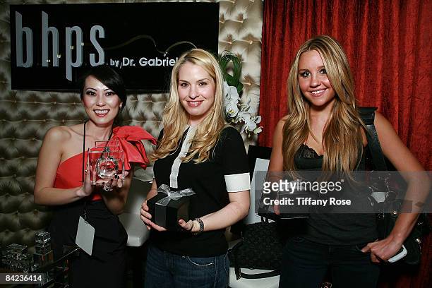 Christine Chiu of BHPS, talent manager Leslie Grossmam and actress Amanda Bynes pose at the Golden Globe Gift Suite Presented by GBK Productions on...