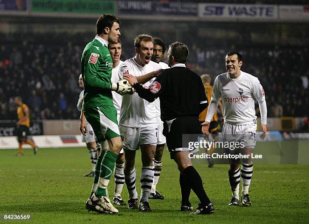 Billy Jones and Goalkeeper Andy Lonergan of Preston appeal to the referee Colin Webster after he seems to give a penalty but later changed his...