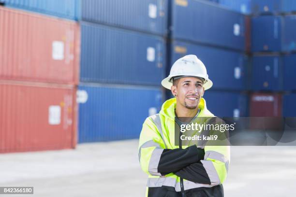 mixed-race hispanic man working at shipping port - docker stock pictures, royalty-free photos & images