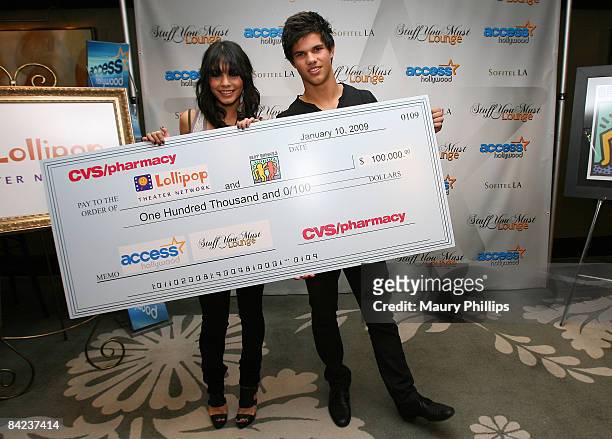 Actress Vanessa Hudgens and Actor Taylor Lautner attends the Access Hollywood "Stuff You Must..." Lounge produced by On 3 Productions celebrating the...