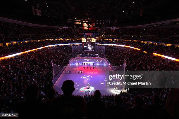 Members of the Colorado Avalanche and Pittsburgh Penguins stand on the ice for the National Anthem at the Pepsi Center on January 10, 2009 in Denver,...