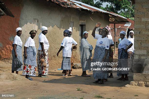 File picture of members of a group of traditional Palala women leaving a meeting on December 4, 2008 in Palala, central Liberia. Women in this...