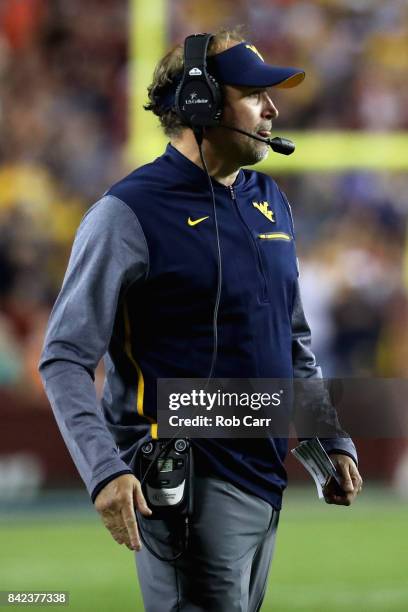 Head coach Dana Holgorsen of the West Virginia Mountaineers watches looks on against the Virginia Tech Hokies at FedExField on September 3, 2017 in...