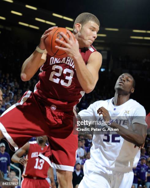 Forward Blake Griffin of the Oklahoma Sooners pulls down a defensive rebound past forward Jamar Samuels of the Kansas State Wildcats during the first...