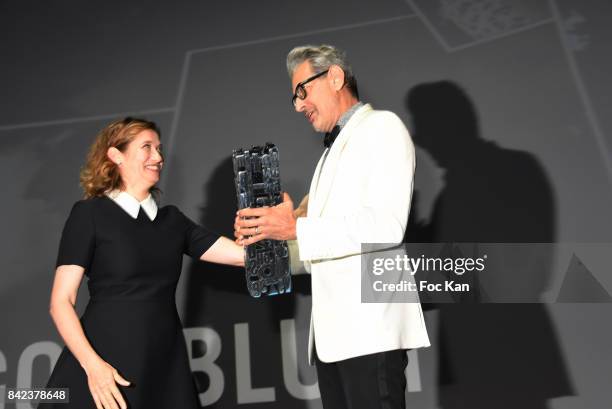 Jeff Goldblum receives from Emmanuelle Devos a trophy designed by Karl Lagasse during the Tribute to Jeff Goldblum and 'Kidnap' Premiere during the...