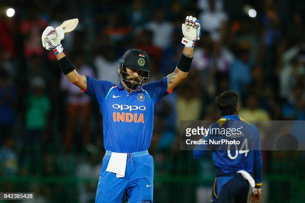 Indian cricket captain Virat Kohli celebrates after scoring 100 runs during the 5th and final One Day International cricket match between Sri Lanka...