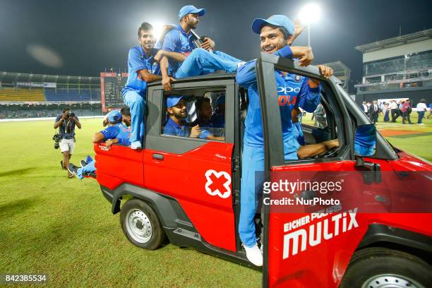 The Indian cricket team take a ride in a van after winning the ODI series against the host Sri Lanka by 5-0 after the 5th and final One Day...