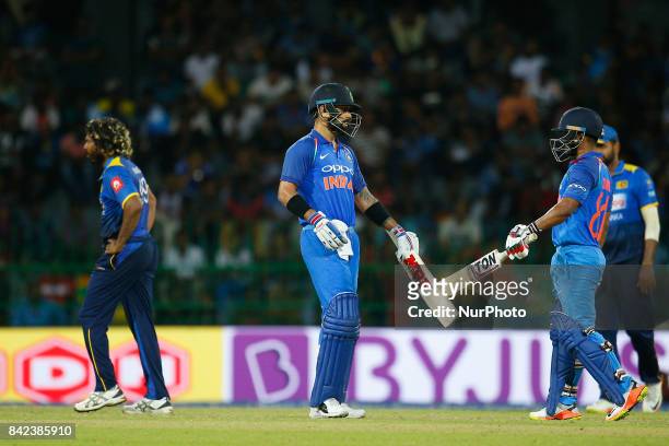 Indian cricket captain Virat Kohli and Kedar Jadhav congratulate each other during the 5th and final One Day International cricket match between Sri...