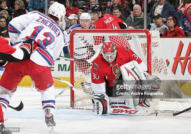 Brian Elliott of the Ottawa Senators makes a save against a shot in tight by Nikolai Zherdev of the New York Rangers at Scotiabank Place on January...