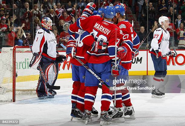 Teammates Karl Alzner and Brent Johnson of the Washington Capitals stand in the background as Robert Lang Andrei Markov and Alex Kovalev all of the...