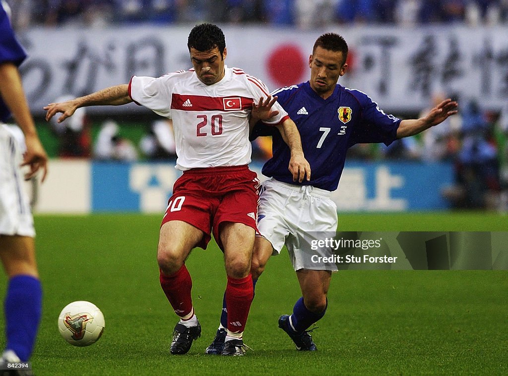 Hidetoshi Nakata of Japan and Hakan Unsal of Turkey