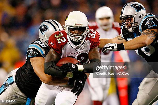 Edgerrin James of the Arizona Cardinals is tackeled by the Carolina Panthers during the NFC Divisional Playoff Game on January 10, 2009 at Bank of...