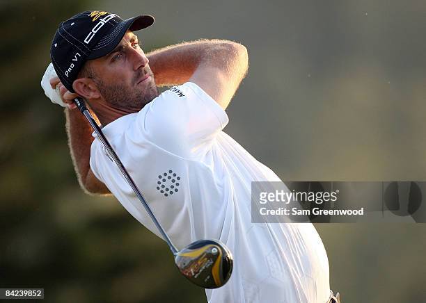 Geoff Ogilvy of Australia hits a shot during the third round of the Mercedes-Benz Championship at the Plantation Course on January 10, 2009 in...
