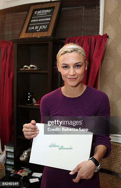 Actress Samaire Armstrong poses with the J&A Footwear Athena Alexander / Callisto of California / Lia Bijou display during the HBO Luxury Lounge in...