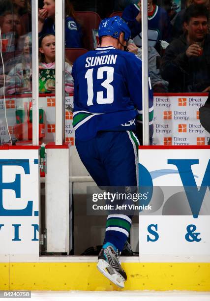 Mats Sundin of the Vancouver Canucks steps into the penalty box after taking a penalty against the San Jose Sharks during their game at General...