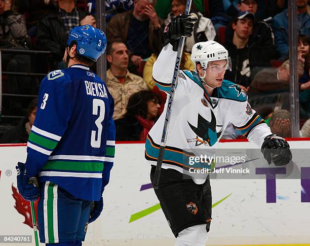 Tomas Plihal of the San Jose Sharks celebrates a goal as Kevin Bieksa of the Vancouver Canucks skates away dejected during their game at General...