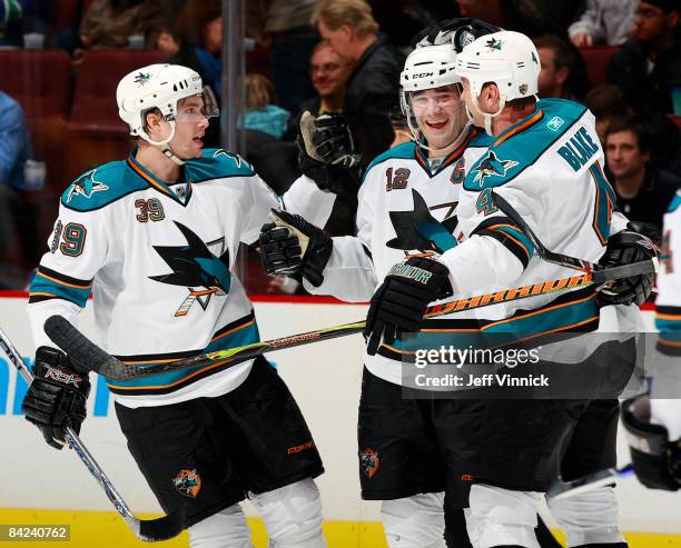 Tomas Plihal, Patrick Marleau and Rob Blake of the San Jose Sharks celebrate a goal against the Vancouver Canucks during their game at General Motors...