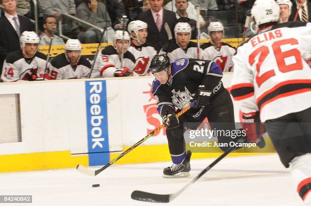 Alexander Frolov of the New Jersey Devils drives the puck against Patrik Elias of the Los Angeles Kings during the game on January 10, 2009 at...