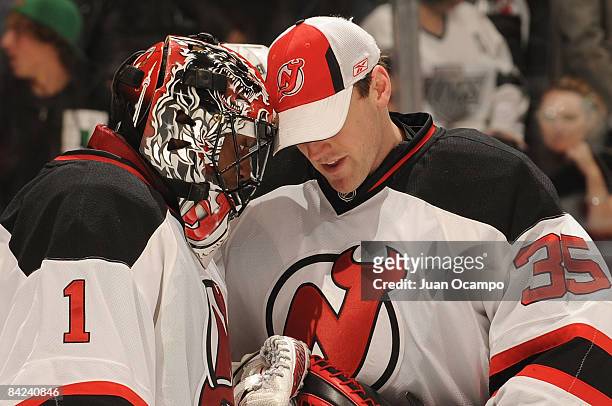 Scott Clemmensen of the New Jersey Devils congratulates teammate Kevin Weekes for a win against the Los Angeles Kings during the game on January 10,...