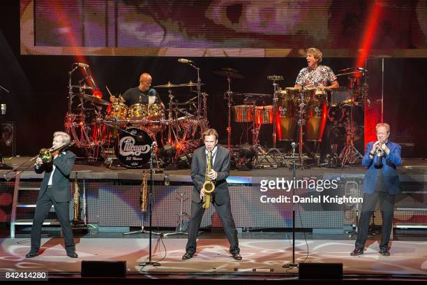 Musicians Nick Lane, Tris Imboden, Ray Herrmann, Walfredo Reyes, Jr., and Lee Loughnane of Chicago perform on stage at San Diego Civic Theatre on...