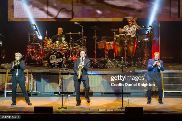 Musicians Nick Lane, Tris Imboden, Ray Herrmann, Walfredo Reyes, Jr., and Lee Loughnane of Chicago perform on stage at San Diego Civic Theatre on...