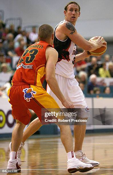 Ben Knight of the Wildcats looks for a team mate during the round 17 NBL match between the Melbourne Tigers and the Perth Wildcats at the State...