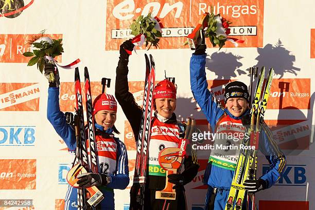Olga Medvedtseva of Russia, Kati Wilhelm of Germany and Helena Jonsson poses for a picture after he Women mass start of the E.ON Ruhrgas IBU Biathlon...