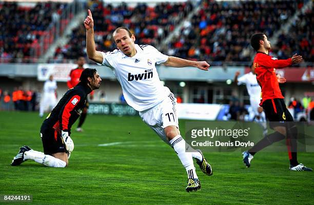 Arjen Robben of Real Madrid celerates after scoring their first goal during the La Liga match betwen Mallorca and Real Madrid at the San Moix stadium...