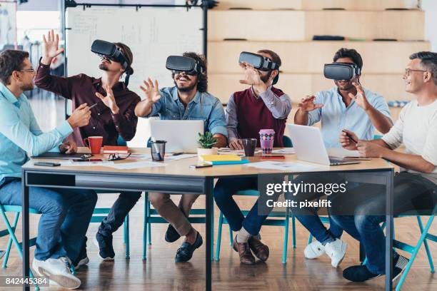 testing the new vr headsets - employee engagement virtual stock pictures, royalty-free photos & images