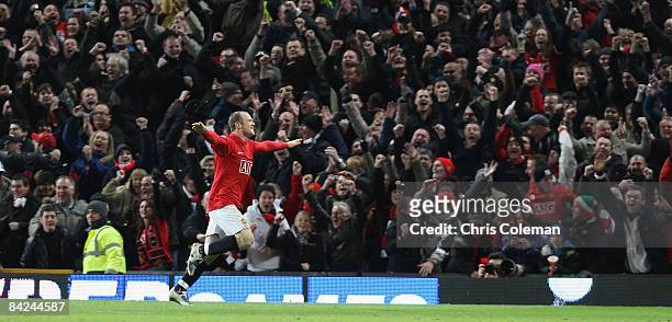 Wayne Rooney of Manchester United celebrates scoring their second goal during the Barclays Premier League match between Manchester United and Chelsea...