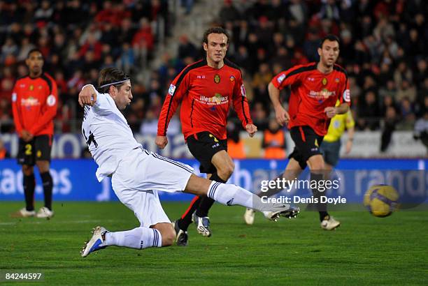 Sergio Ramos of Real Madrid scores Real's third goal during the La Liga match betwen Mallorca and Real Madrid at the San Moix stadium on January 11,...