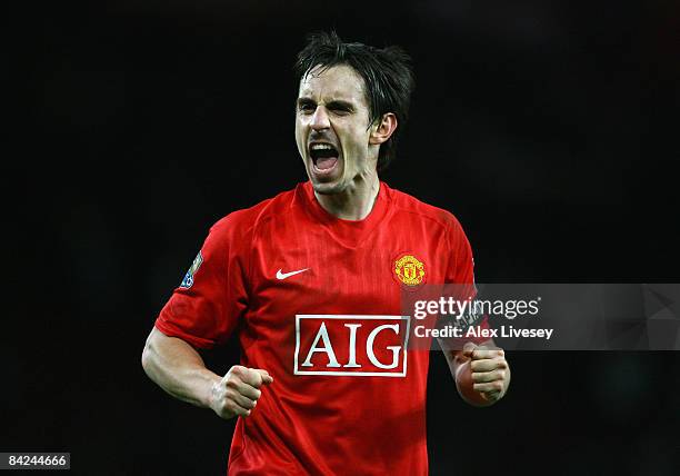 Gary Neville of Manchester United celebrates his team's victory at the end of the Barclays Premier League match between Manchester United and Chelsea...