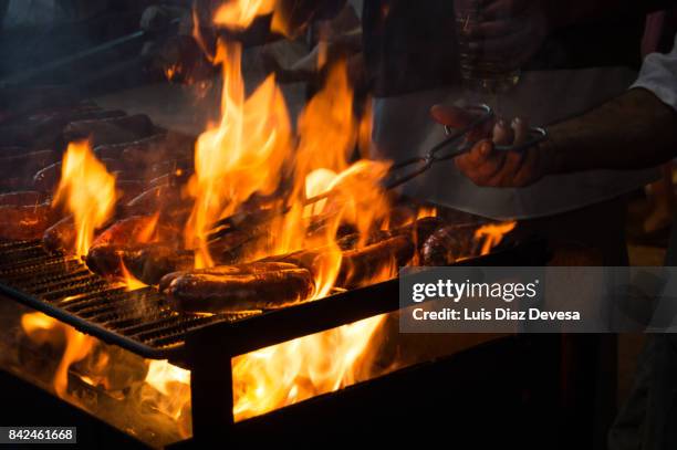 barbecuing chorizo sausages - barbeque sauce stock pictures, royalty-free photos & images