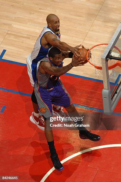 Amar'e Stoudemire of the Phoenix Suns and Brian Skinner of the Los Angeles Clippers reach for a rebound during their game at Staples Center on...