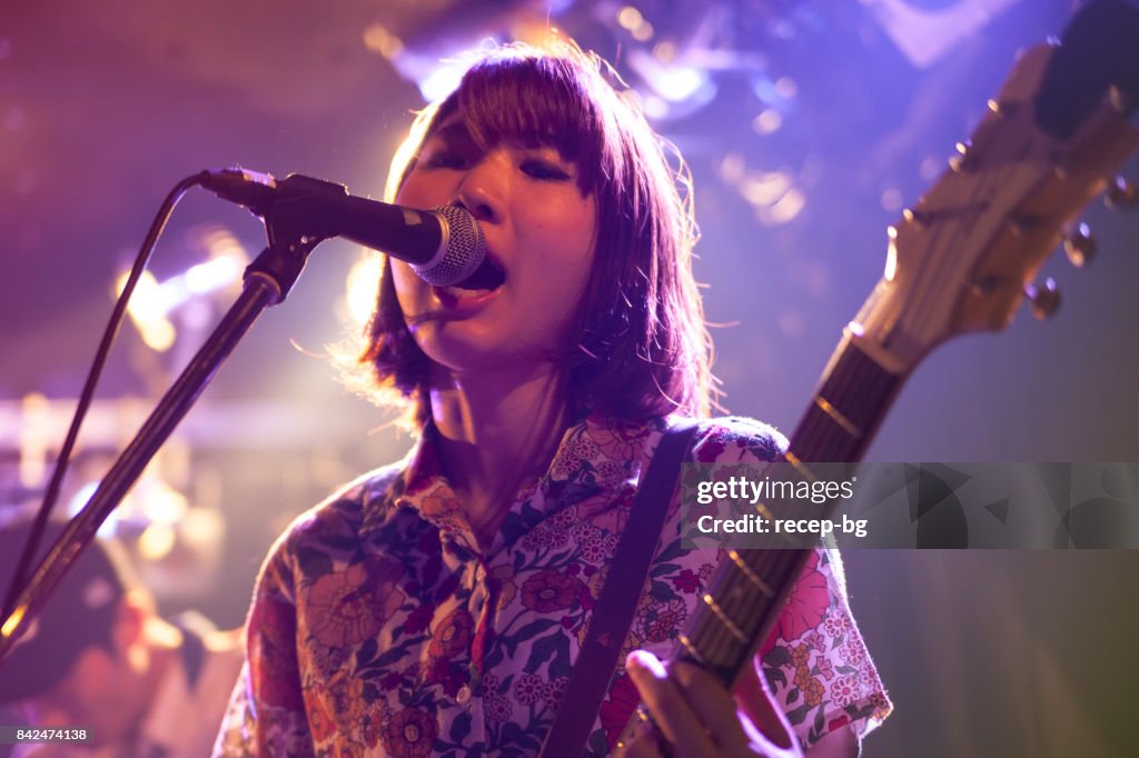 Woman Playing The Guitar