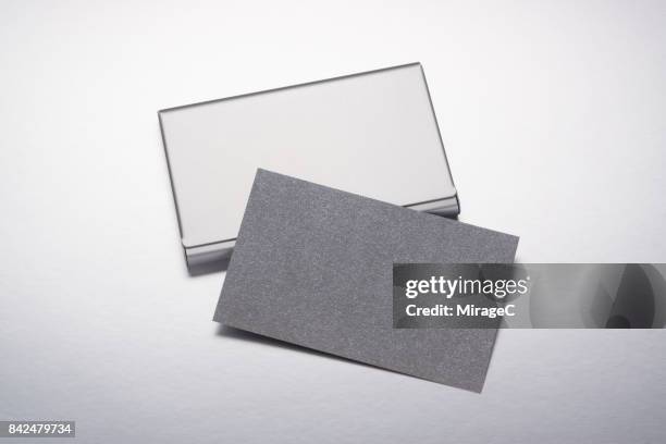 blank business cards in cardcase - metallic suit stock pictures, royalty-free photos & images